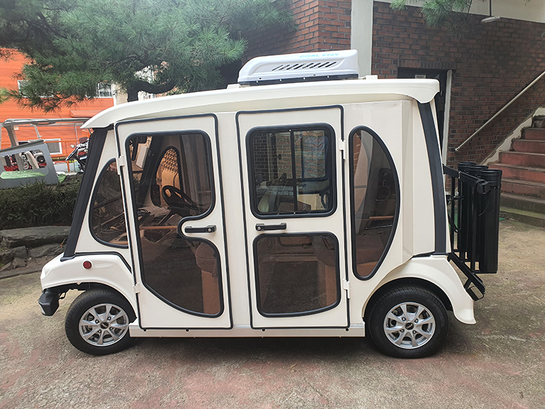 냉난방캐빈형 e-골프카트 시작차 제품.